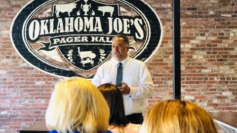 A man speaking at a convention